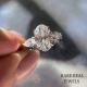 Oval Moissanite Three Stone Engagement Ring: White Gold Cathedral Setting