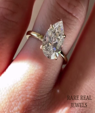  Pear Moissanite Engagement Ring: Yellow Gold Solitaire